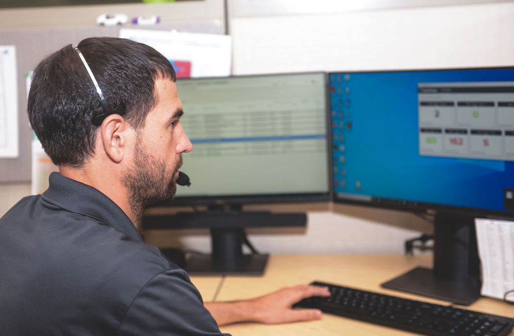 Technician monitoring managed systems